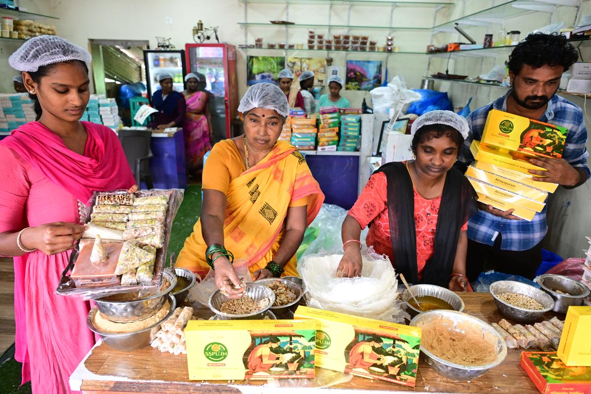 Women making putharekulu at a shop in Dr. B.R. Ambedkar Konaseema district.