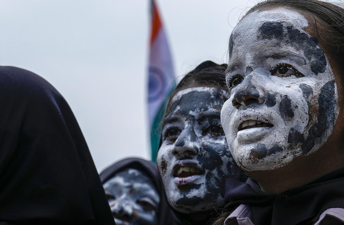 Students of Everwin School with their faces painted with Moon celebrate the pre-soft landing of Chandrayaan-3, in Chennai.