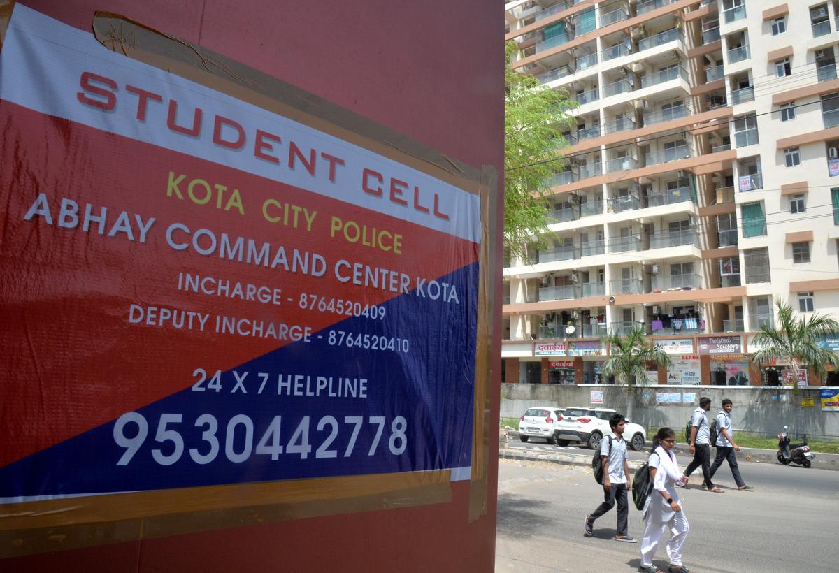 A student helpline number on a poster in Kota.