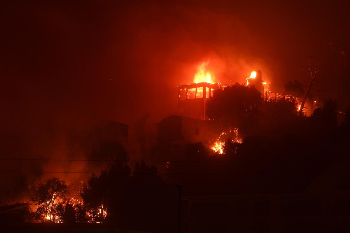 A building burns during the Palisades Fire in the Pacific Palisades neighborhood of west Los Angeles, California, U.S. on January 7, 2025. 