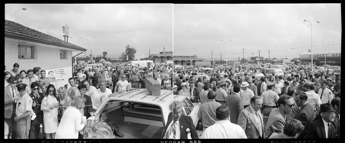 People mill around a shopping center parking lot in Laurel, Md., after an assassination attempt on Alabama Gov. George Wallace, who was campaigning for president, on May 15, 1972. Wallace was paralyzed by shots fired by Arthur Bremer.