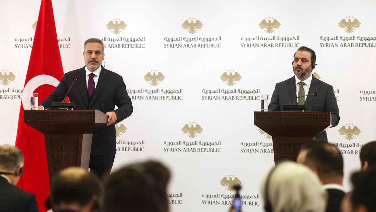 Clashes flare as top Turkish officials visit Syria ahead of a deadline for Kurdish integration