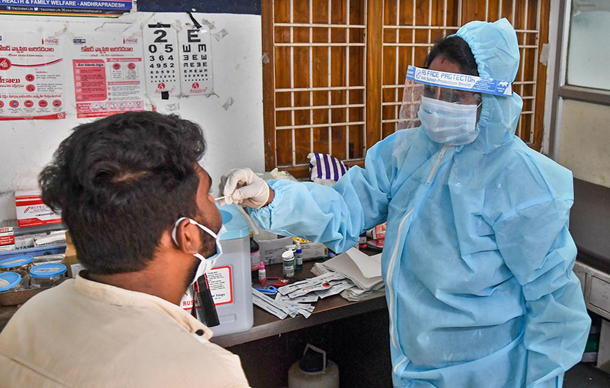 Swab samples are being taken for COVID-19 testing. file