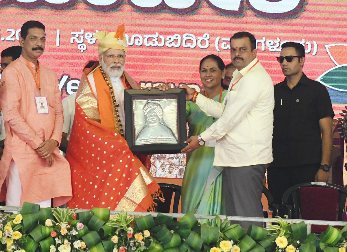 BJP leaders congratulating Prime Minister Narendra Modi at an election rally in Mulki on Wednesday. 