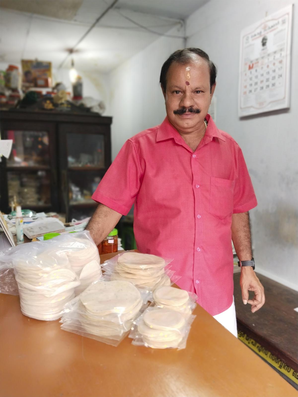V Madhusoodanan at his pappadam shop in Chala market