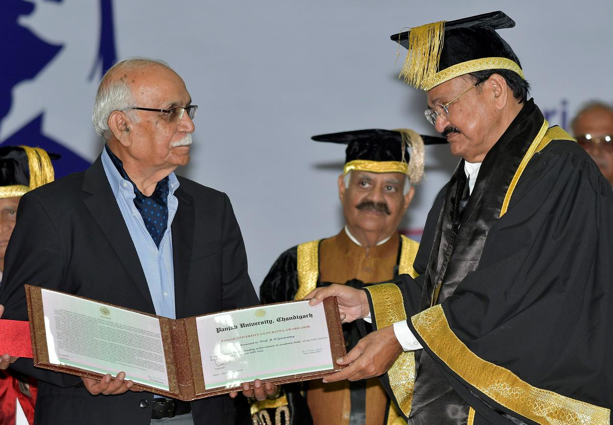 Former Vice President M. Venkaiah Naidu presenting Gyan Ratna award to Prof Goswami during the 67th convocation of Punjab University in Chandigarh on March 4, 2018.