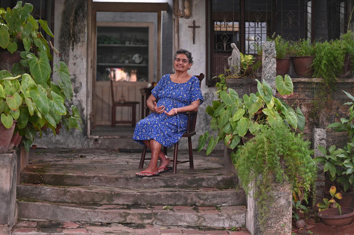 Margaret Dawson outside her home, Hillside