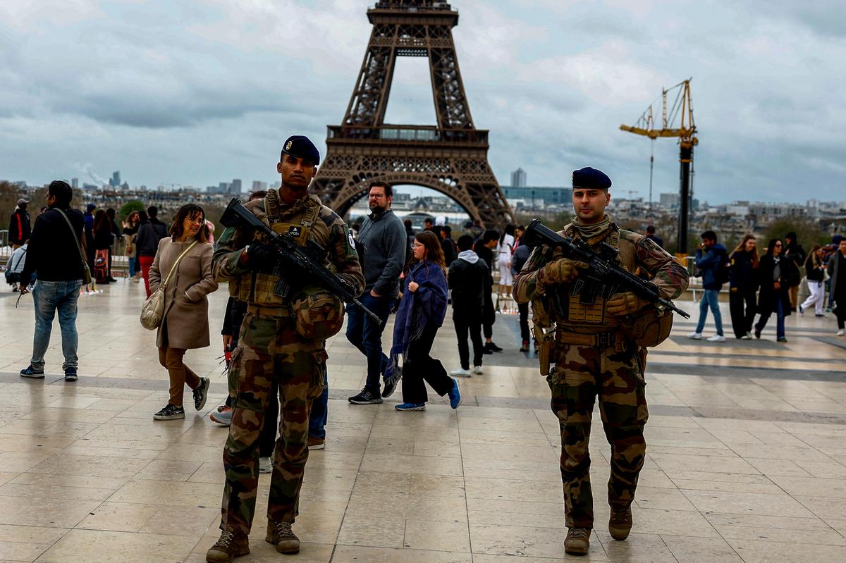 Armed French soldiers patrol on the Trocadero square as part of the “Vigipirate” security near the Eiffel Tower Stadium, Champ de Mars Arena and Grand Palais Ephemere venues.