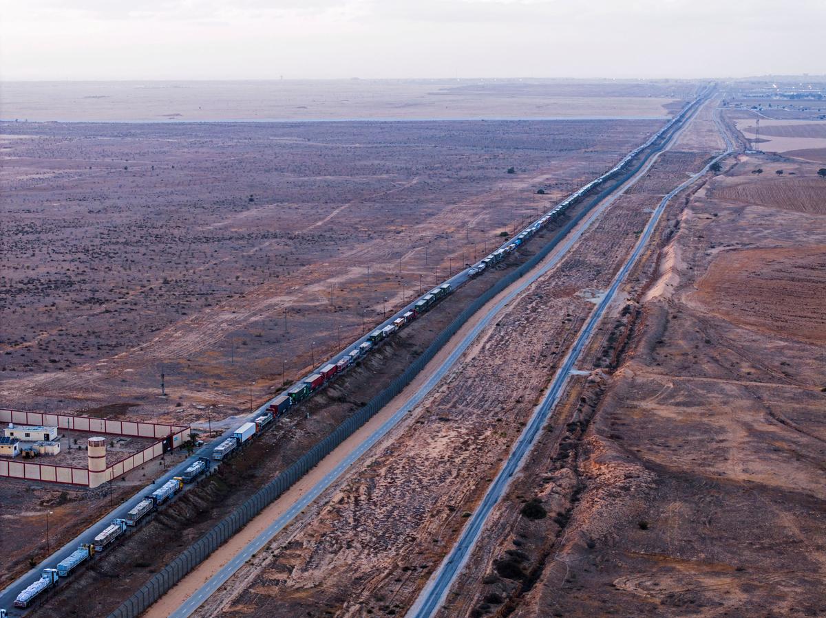 A drone shot shows the number of aid trucks on an Egyptian road along the border with Israel waiting to enter Rafah on May 2, 2024. 