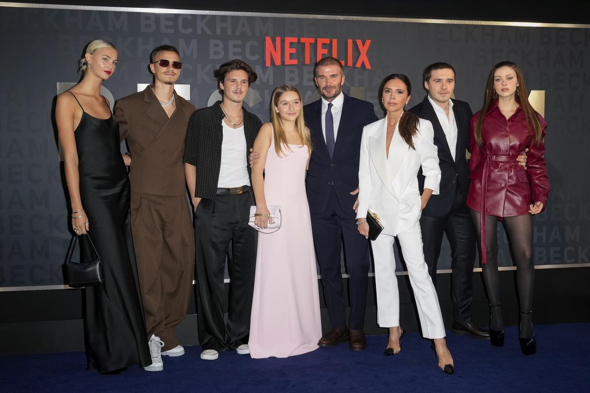 Mia Regan, from left, Romeo Beckham, Cruz Beckham, Harper Beckham, David Beckham, Victoria Beckham, Brooklyn Beckham and Nicola Peltz Beckham pose at the premiere of ‘Beckham’ 