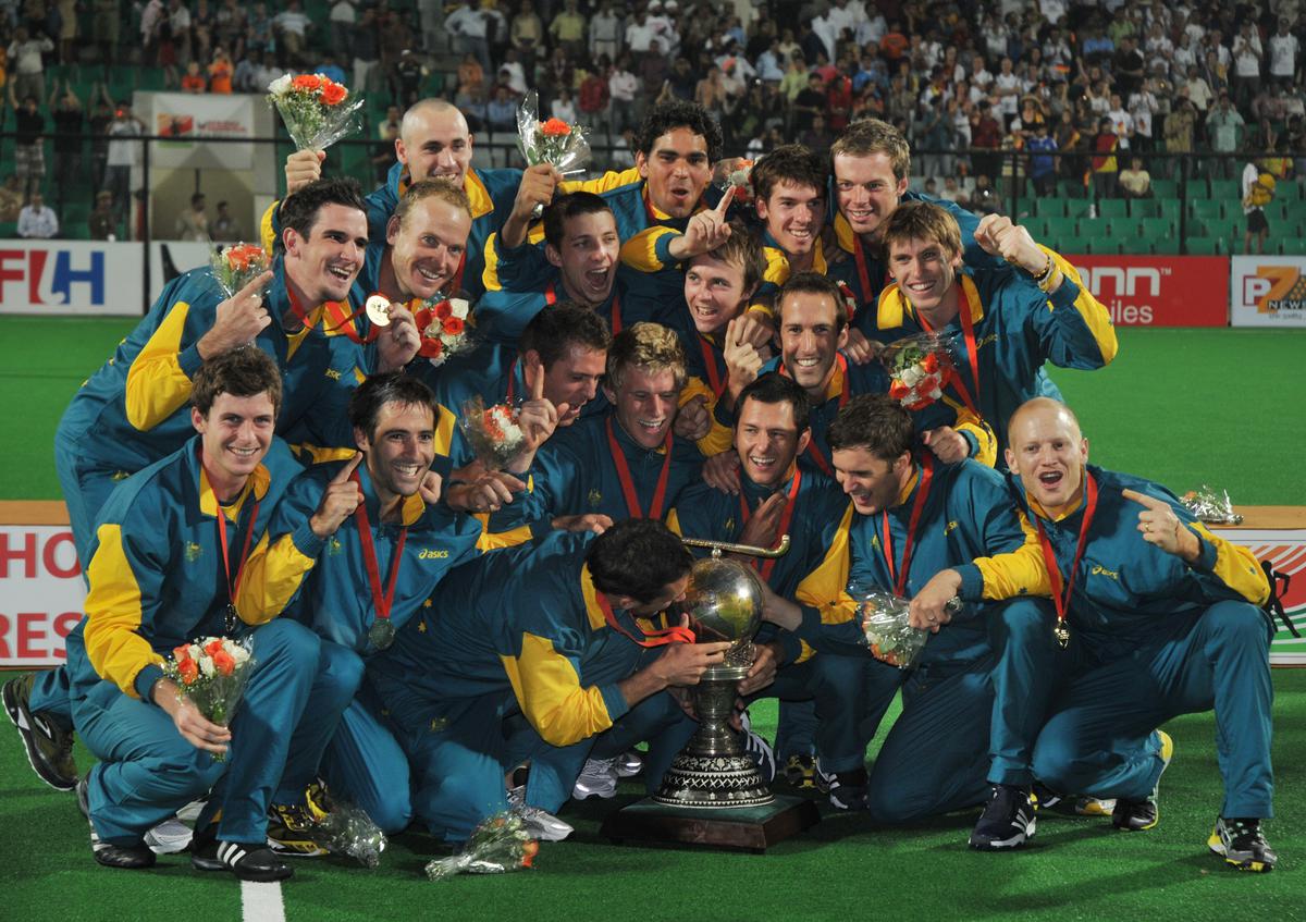 The Australian team celebrates with the trophy after beating Germany in the World Cup final in New Delhi, 2010.