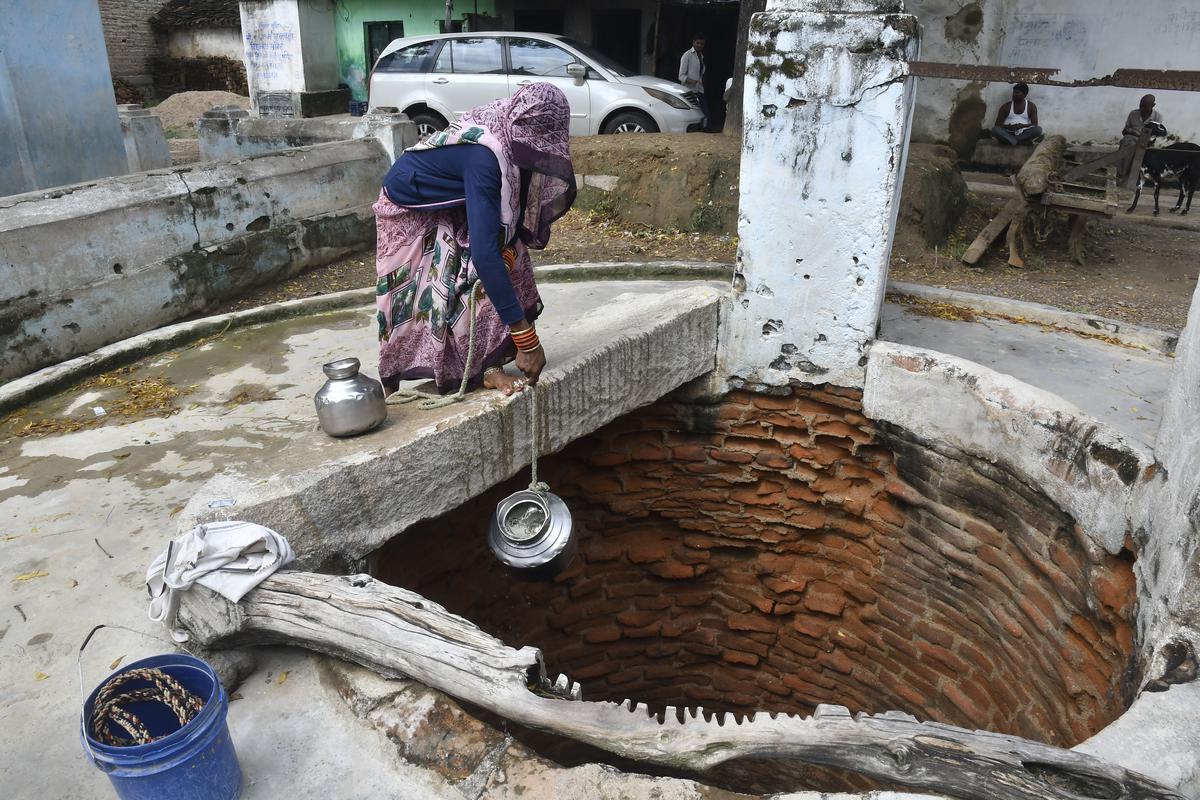A resident seen filling water from a well, every household tap connections provided under Har Ghar Jal scheme as part of Jal Jeevan Mission, at Luhari Village in Charkhari Block of Mahoba district in Uttar Pradesh, in the Bundelkhand region. 