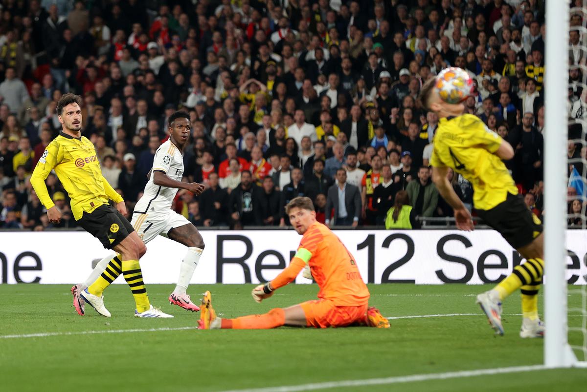 Vinicius Junior of Real Madrid (in white) scores his team’s second goal during the UEFA Champions League 2023/24 Final match between Borussia Dortmund and Real Madrid CF at Wembley Stadium on June 1, 2024 in London, England.