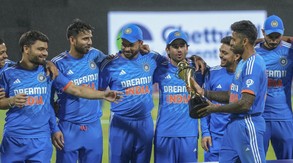 Indian captain Suryakumar Yadav with the trophy after winning the five-match T20I cricket series against Australia, at the M. Chinnaswamy Stadium, in Bengaluru, Sunday, Dec. 3, 2023. 