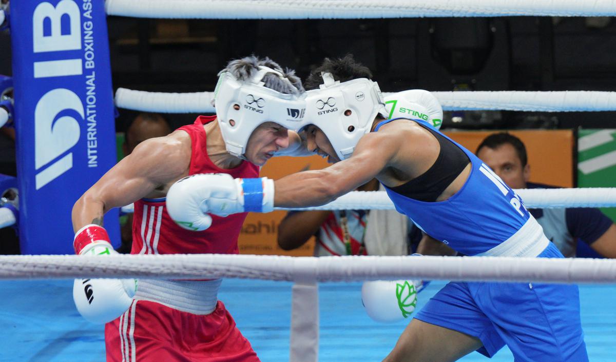 India’s Preeti (blue) in action against Lacramioara Perijoc of Romania during their 54 kg category match at the 2023 IBA Women’s Boxing World Championships, in New Delhi, on March 18, 2023.  