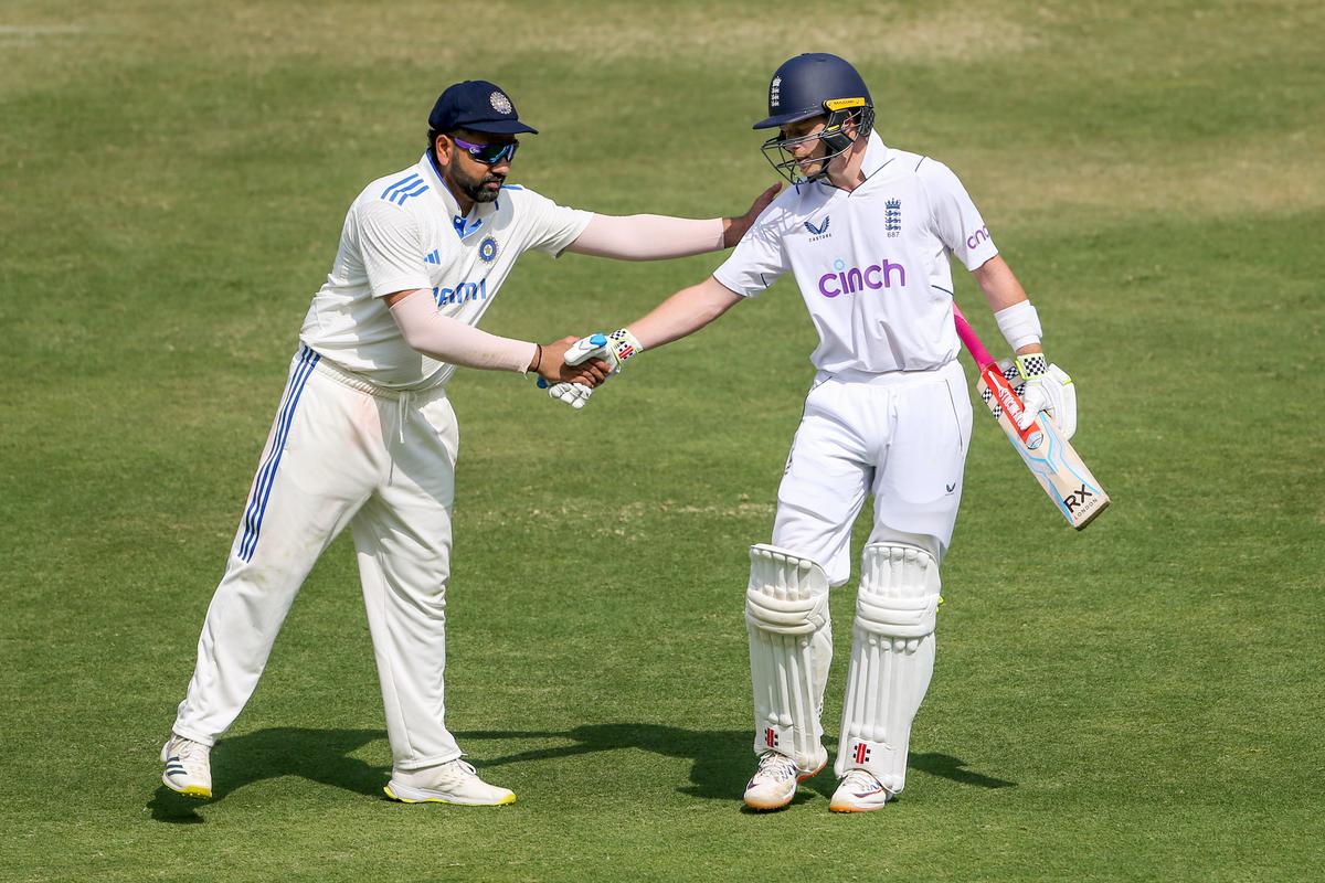 Indian skipper Rohit Sharma congratulates England’s Ollie Pope as he walks back to the pavilion after scoring 196 during the forth day of the first Test match against India at Rajiv Gandhi International Stadium in Hyderabad on Sunday. 