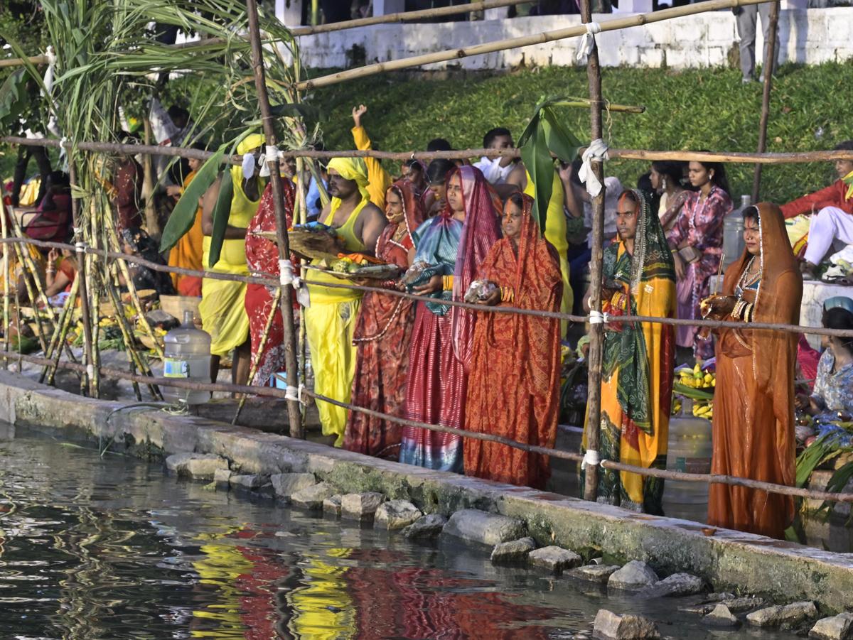 Devotees gather at Bathukamma Ghat, Tank Bund, to offer Sandhya Arghya to the setting sun during Chhath Puja celebrations in Hyderabad on Monday.