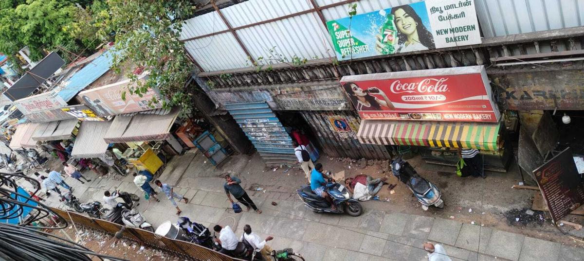 An aerial view of the TASMAC outlet and the narrow service lane near the Chromepet bus terminus.