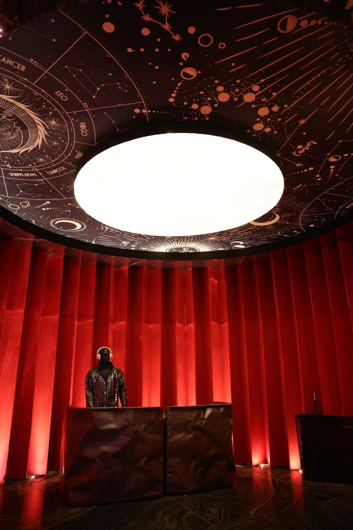 Sumessh Menon’s experiential, red-drenched booth defies a singular function. 