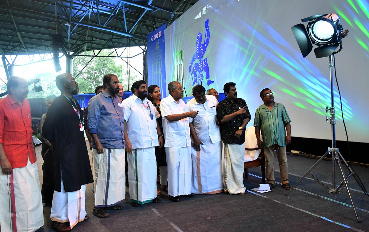 Chief Minister Pinarayi Vijayan switching on the arc lights to mark the inauguration of the 27th edition of IFFK in Thiruvananthapuram on Friday.