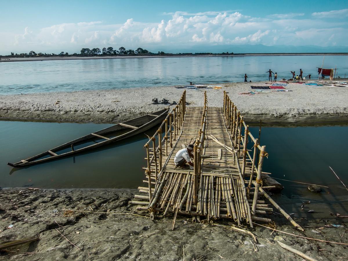 Bamboo as construction material for a bridge across a sandbank on the Brahmaputra in the town of Dibrugarh, Assam.