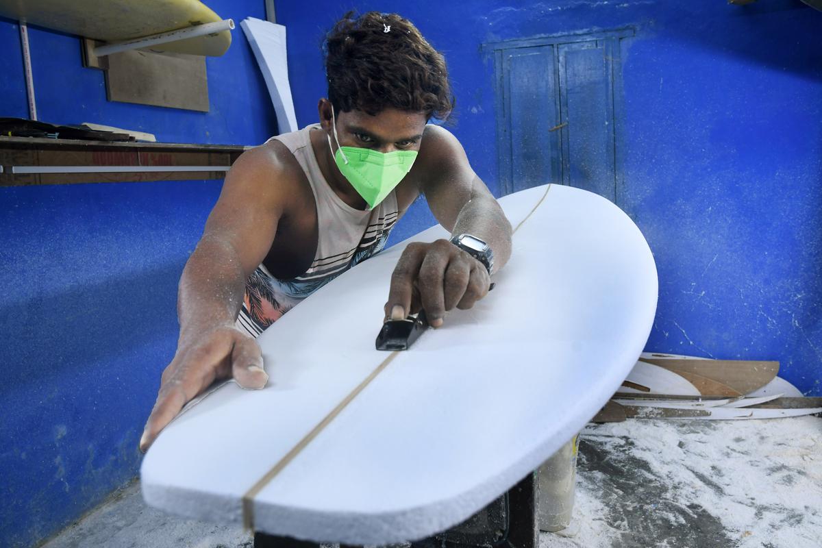 Surfboard manufacturer Santosh in his workshop in Mamallapuram