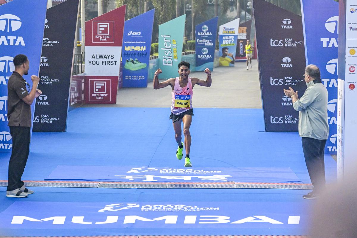 Indian Elite winner Kartik Karkera is ecstatic as he crosses the finish line during the Tata Mumbai Marathon 2026 at the Chhatrapati Shivaji Terminus on Sunday, January 18, 2026.