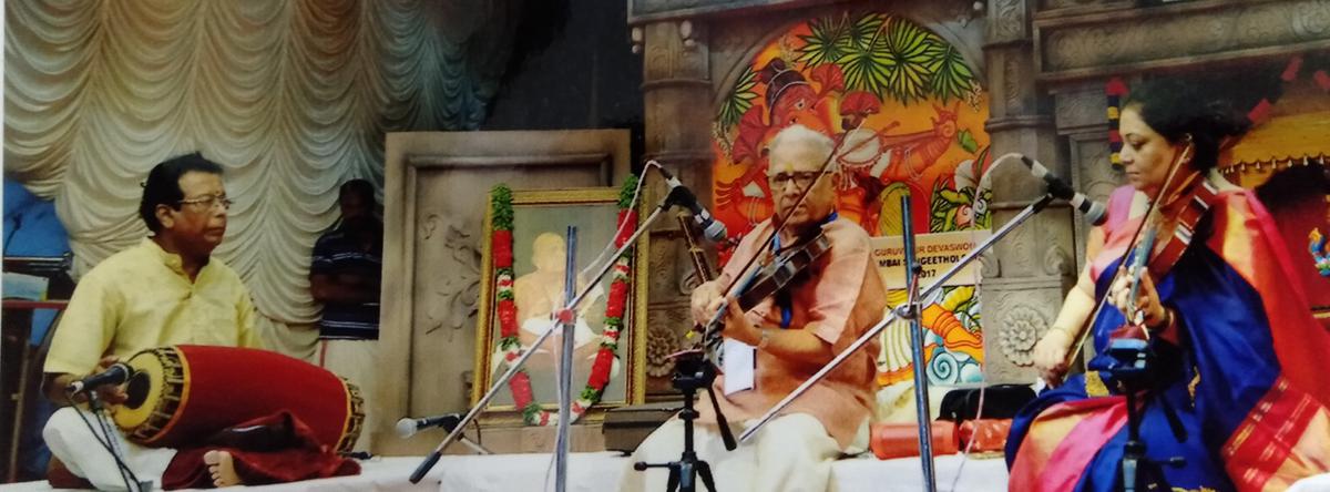 Surendran with Professors TN Krishnan and VIJ Krishnan at a music festival.