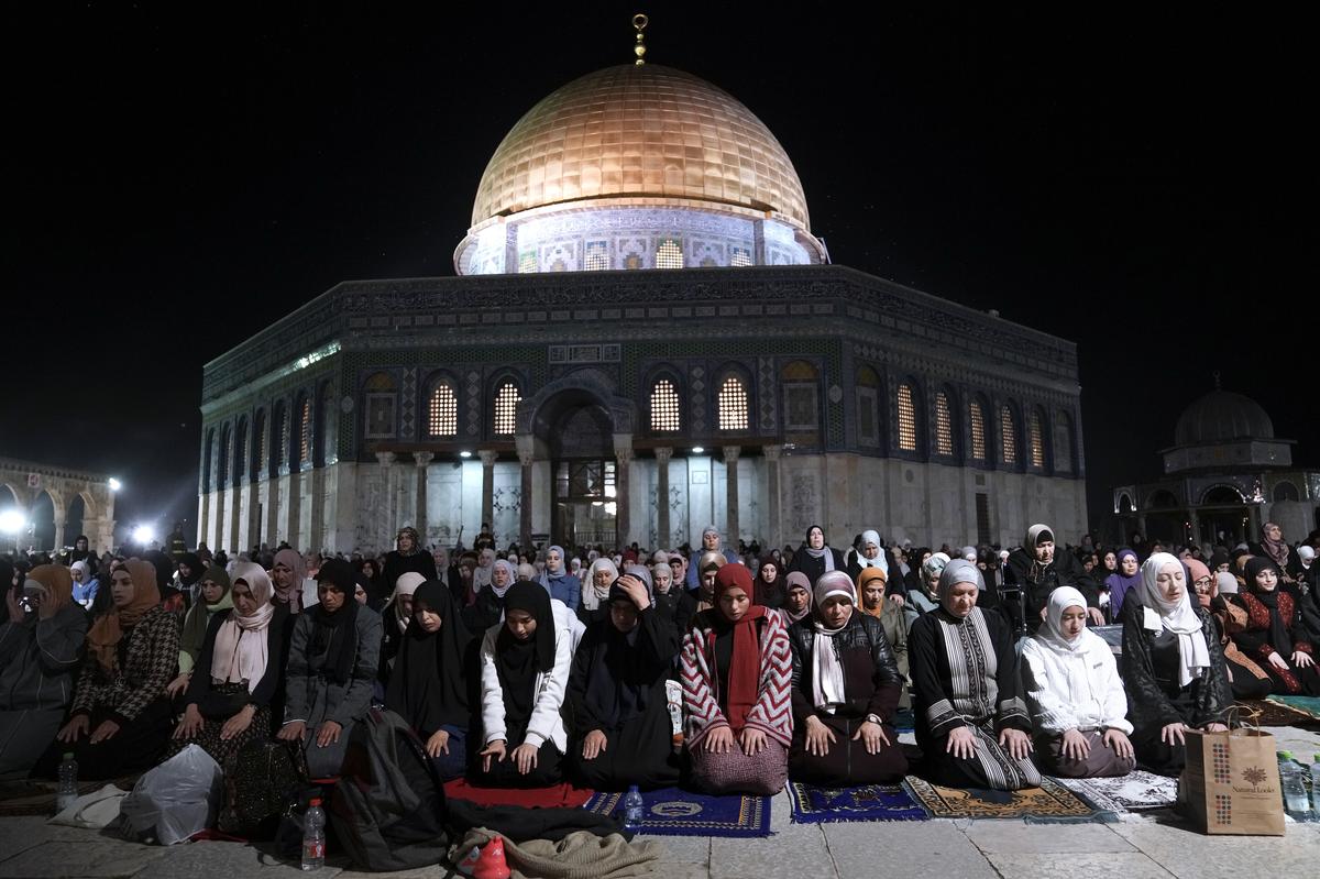 Palestinian worshippers perform “tarawih”, an extra lengthy prayer held during the Muslim holy month of Ramadan, next to the Dome of Rock at the Al-Aqsa Mosque compound in the Old City of Jerusalem, Saturday, April 8, 2023. 