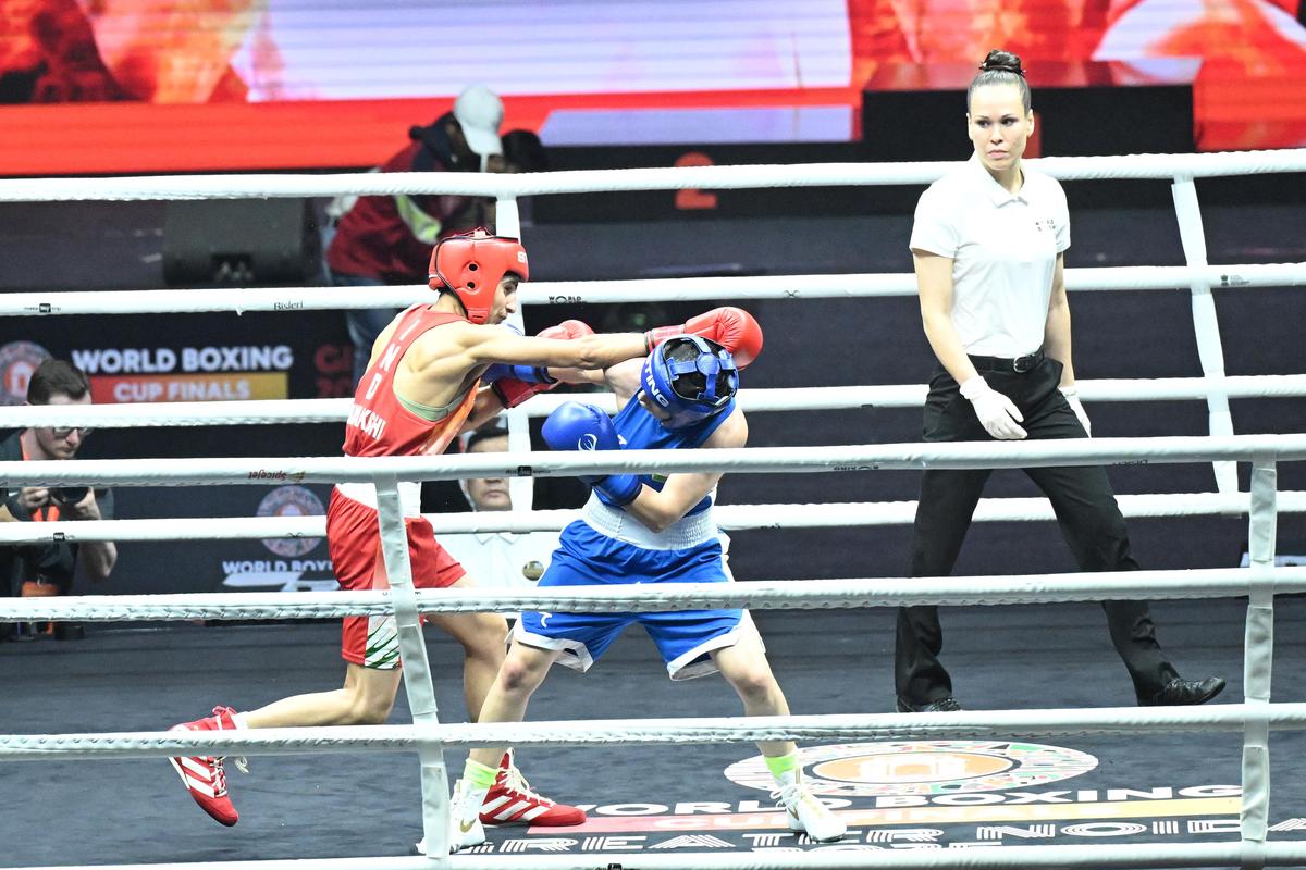 Minakshi lands a punch on Fozilov in the 48kg final. Minakshi lands a punch on Fozilov in the 48kg final.