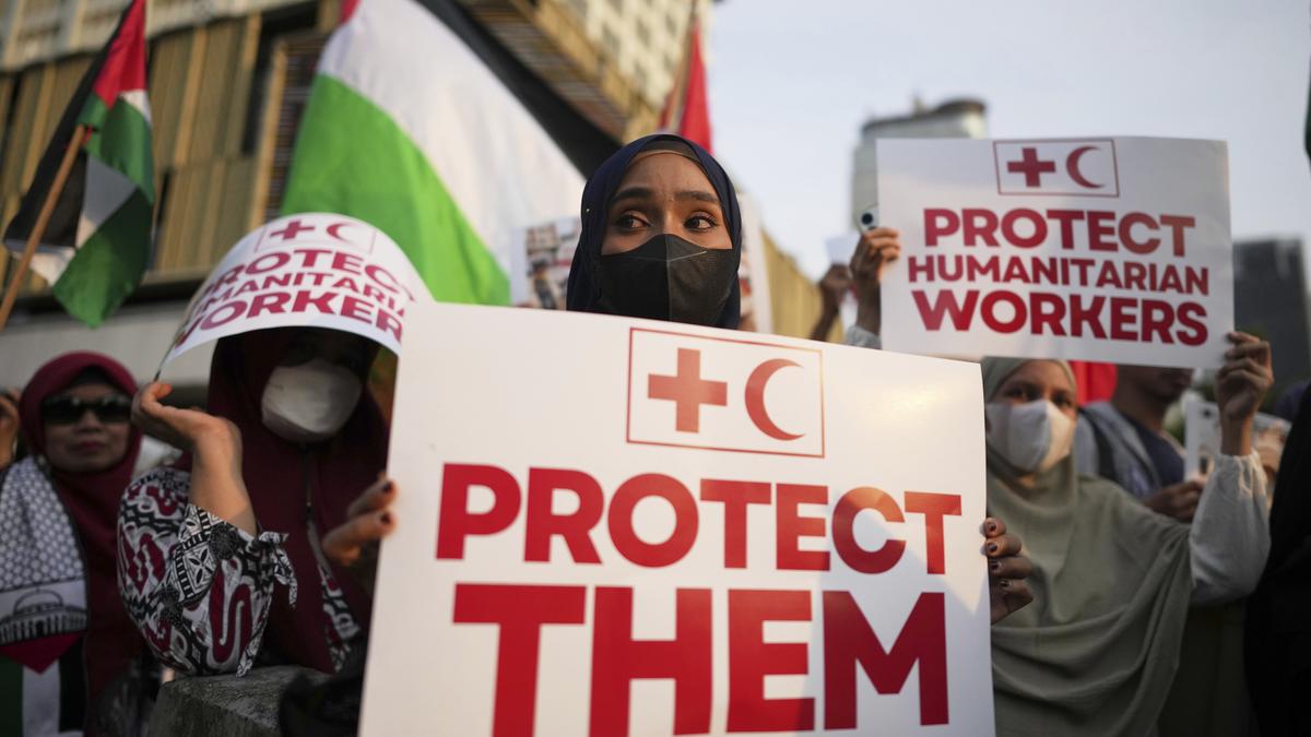 Hamas says it killed 12 ‘Israeli-backed fighters’; Israeli-supported group says they were aid workers