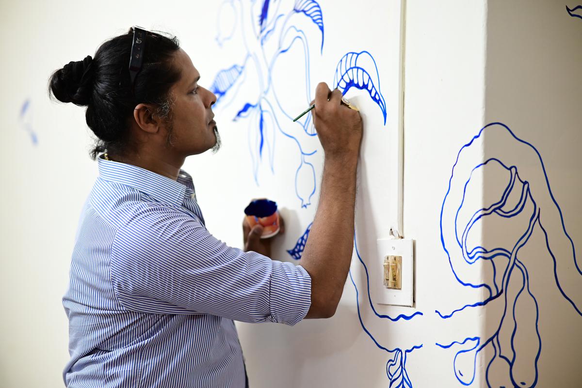 Artist  Mario D’Souza at work on his collection Home away from home 