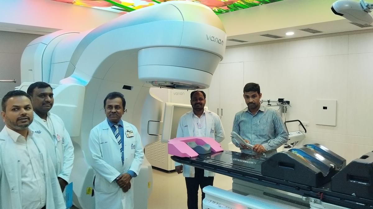 Medical Director and Chief Executive Officer Mallikarjun Jali (centre) and others demonstrating the use of radiation therapy equipment at the KLE Society Cancer Hospital in Belagavi on Tuesday.