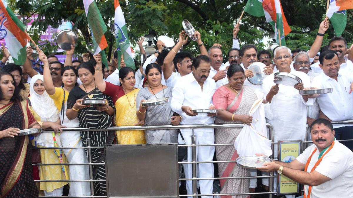 Congress activists beat empty plates protesting against Union government’s denial of rice