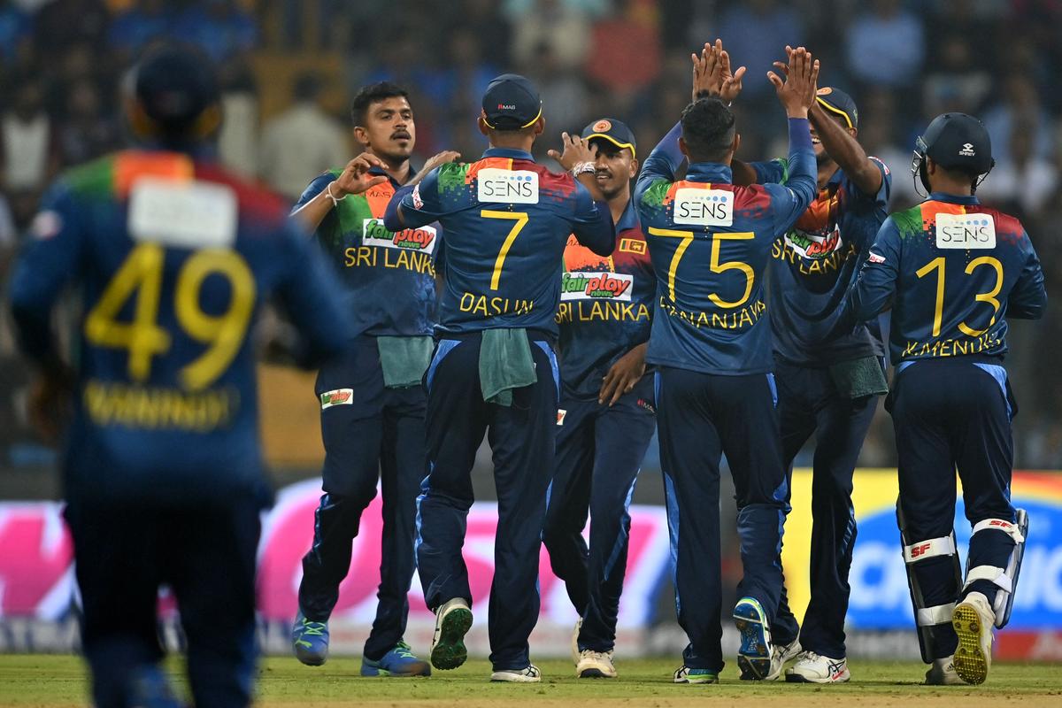 Sri Lanka’s players celebrate after the dismissal of India’s Sanju Samson (not pictured) during the first Twenty20 international cricket match between India and Sri Lanka at the Wankhede Stadium in Mumbai on January 3, 2023.