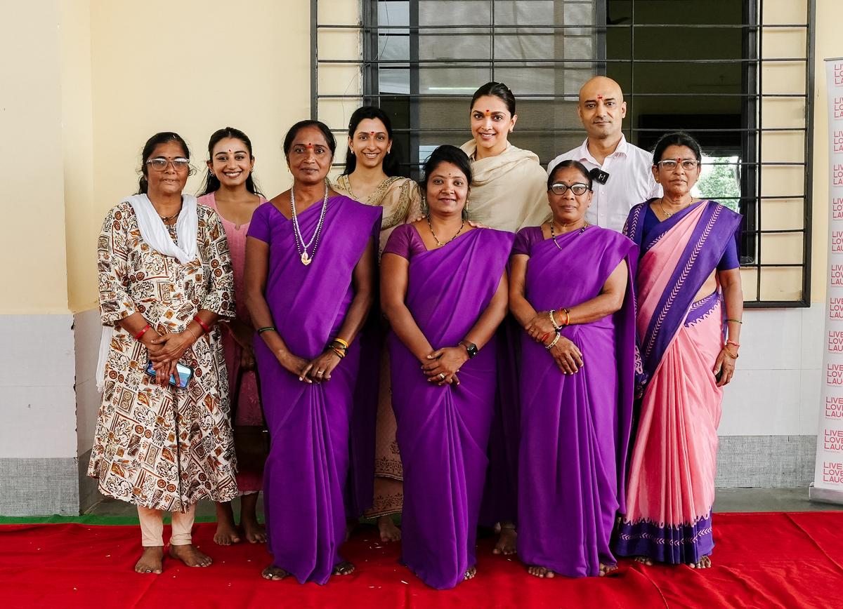 ASHA workers with Live Love Laugh Foundation's Anisha Padukone (back row, center) and her sister, actress Deepika Padukone, in Chindwara, Madhya Pradesh.