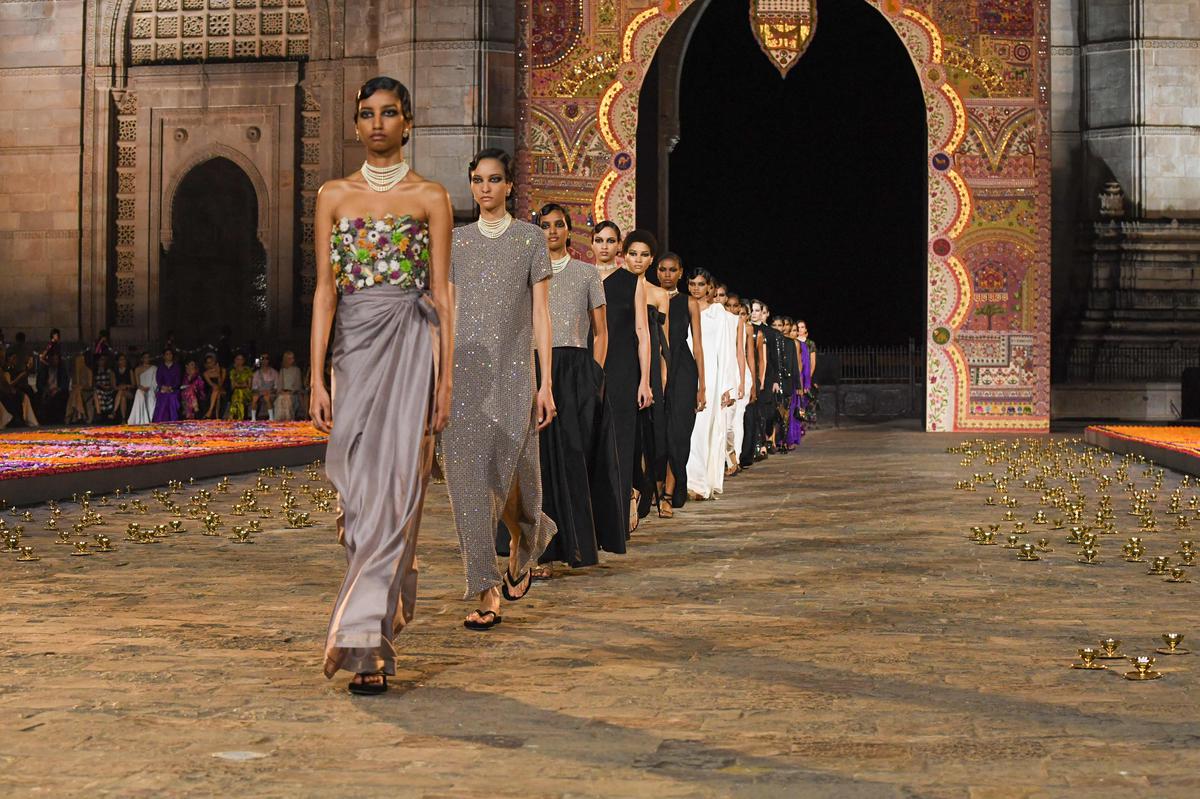 Of the 99 models, most were South Asian, a first for a calendar collection, and making for a proud moment in fashion. (Photo by Indranil MUKHERJEE / AFP)