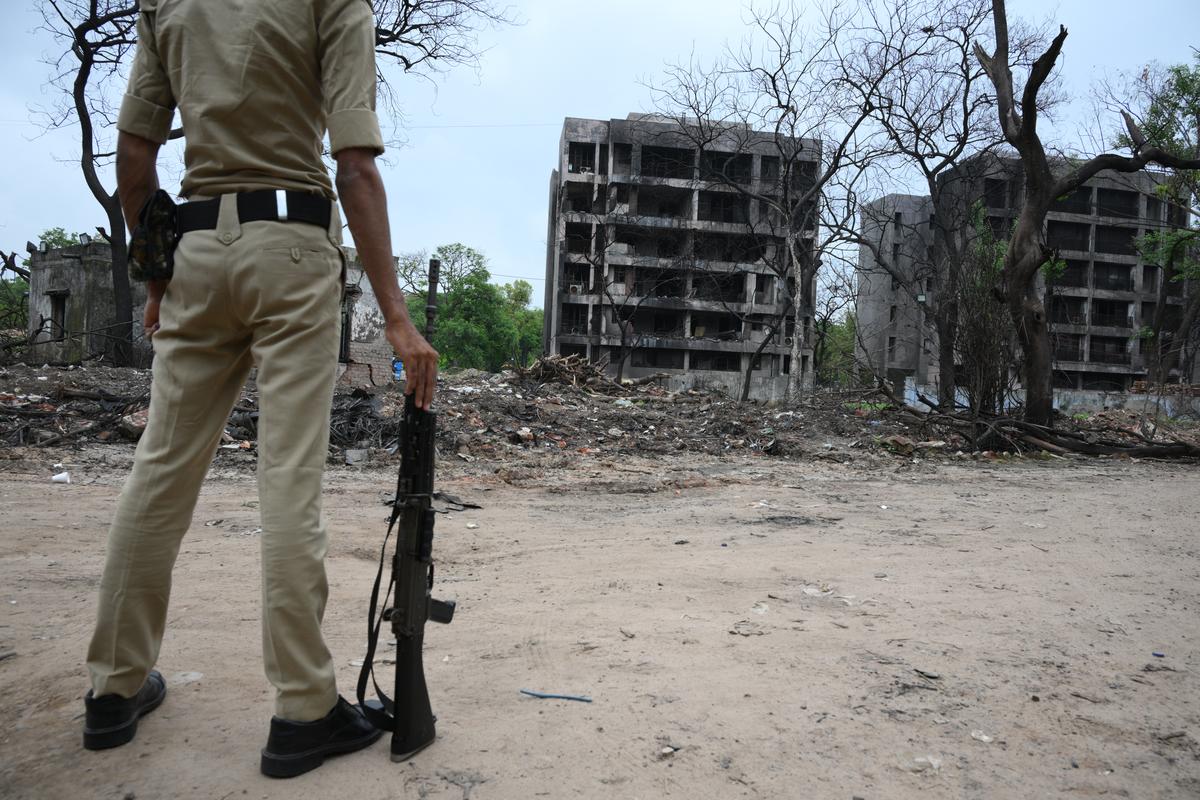 Gujarat Police at the Air India Ahmedabad-London plane Dreamliner Boeing 787 crash site on  July 11, 2025.  