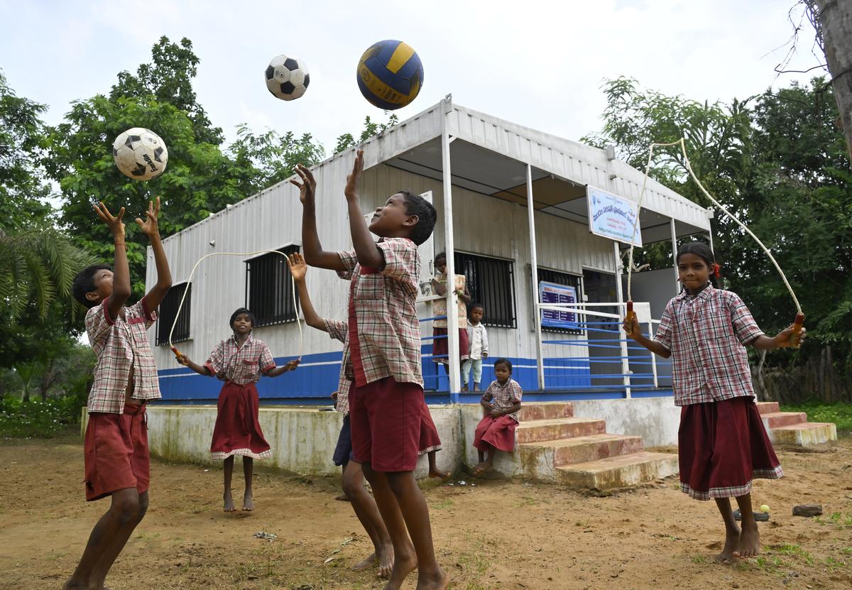 Students play outside the Mandal Parishad Primary School set up in a container at Bangarupalli hamlet of Kanthanapally Gram Panchayat of Kannaigudem mandal in Mulugu district.
