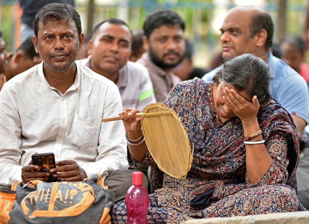 A teacher breaks down at the site of the protest. 