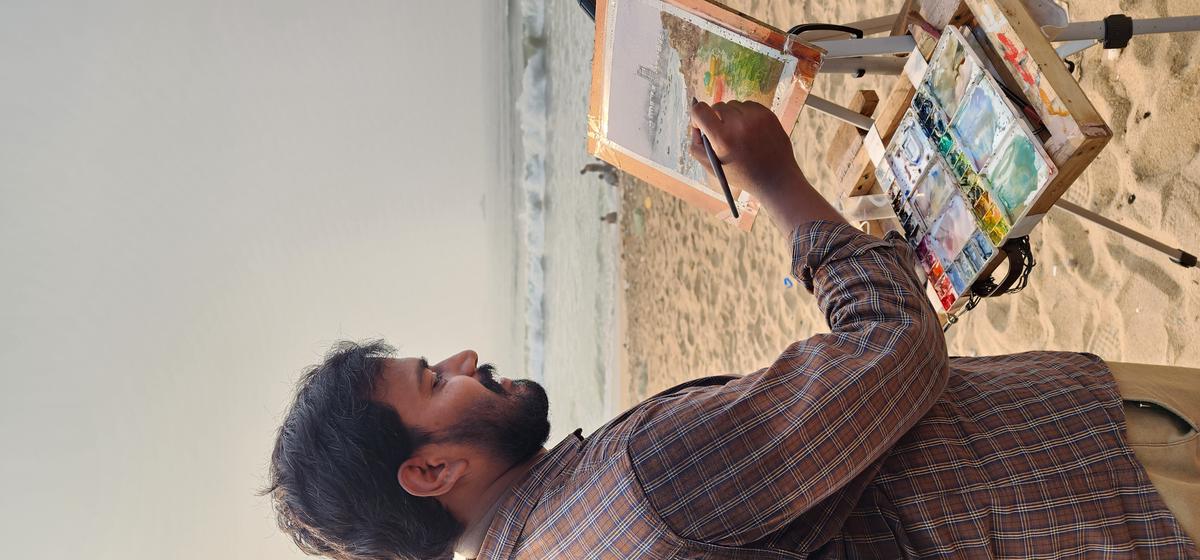 
An artist, who is a part of Vizag Urban Sketchers, during a meet-up at RK Beach in Visakhapatnam. 