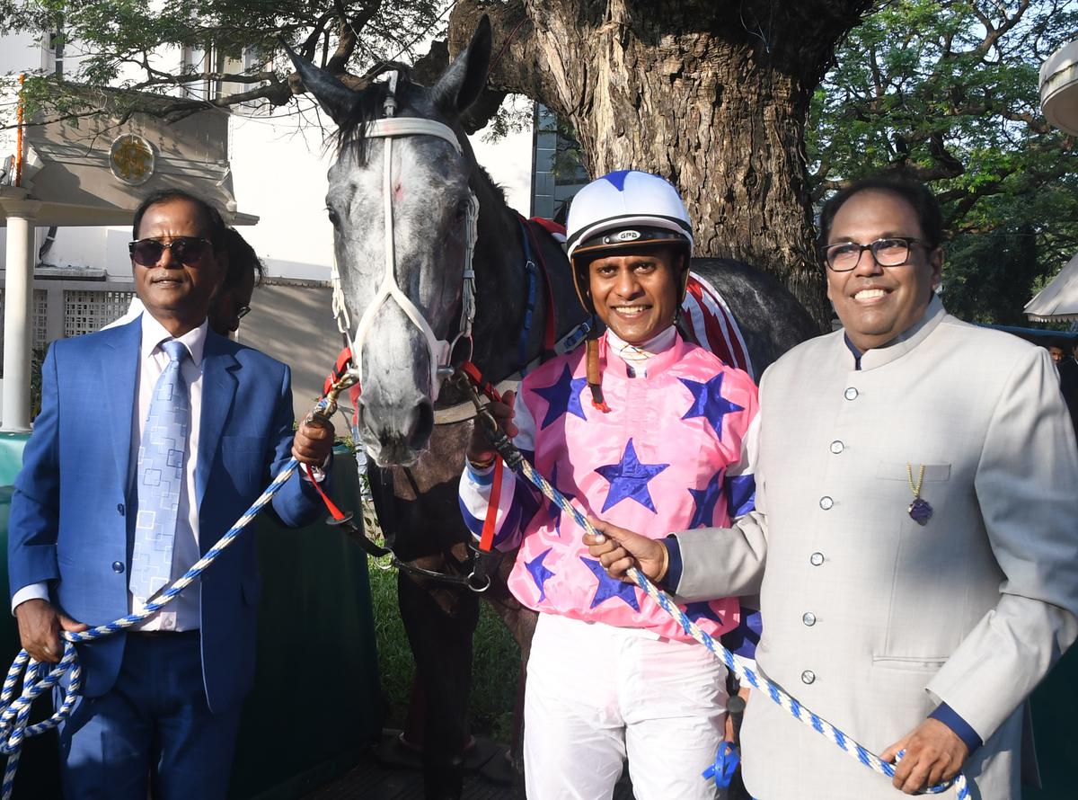 Trainer Satish Narredu, jockey Suraj Narredu and  owner Anil Saraf with Touch of Grey after the colt won the South India Derby Stakes at Madras Race Club, Guindy, in Chennai on Monday (January 15). 