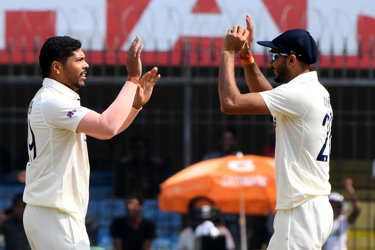 Milestone man: Umesh Yadav celebrates taking his 100th Test wicket on Indian soil.