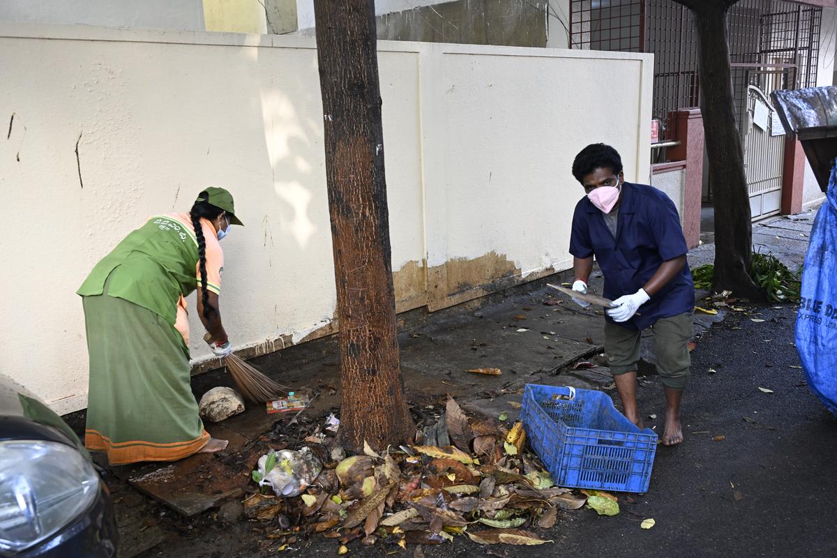 BBMP workers clearing the rubbish from the streets in Bengaluru.