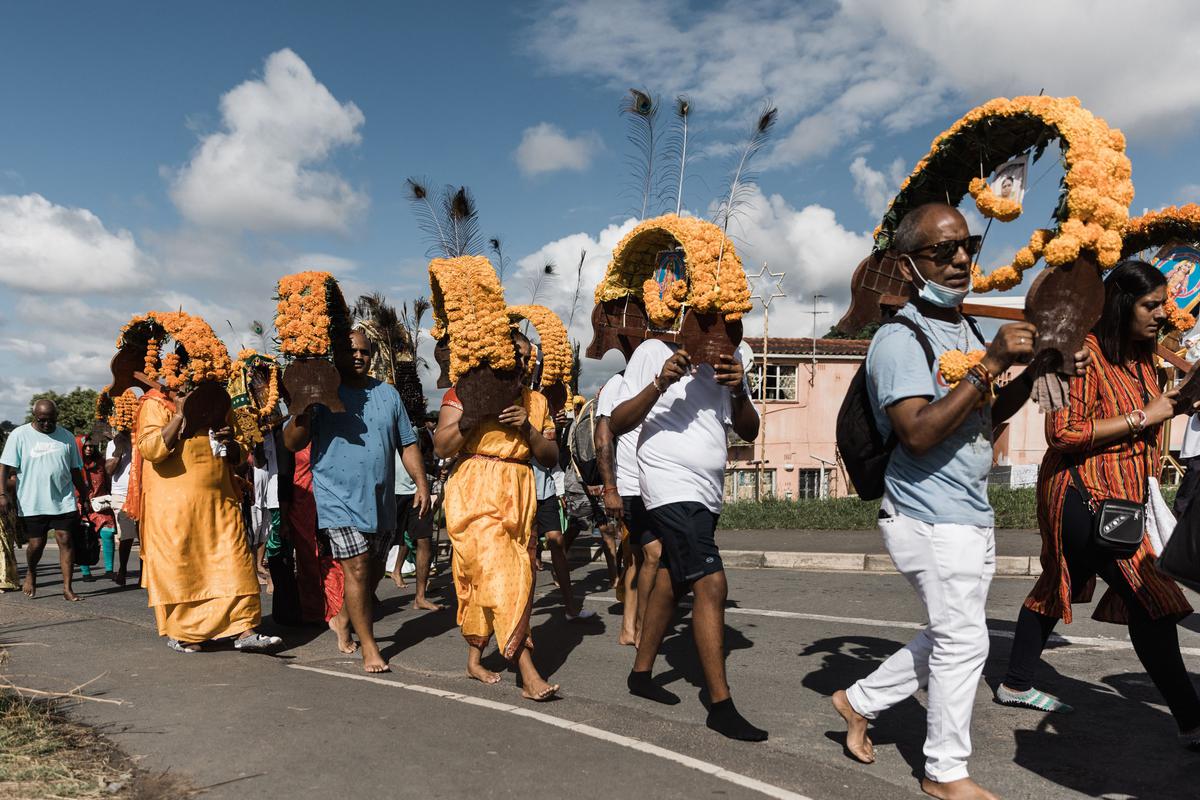 Hindu devotees carry on their shoulders the Kavadi  during the annual Thaipoosam festival at the Chatsworth Magazine Barracks Shree Vishnu Hindu temple in Chatsworth township, north of Durban, South Africa on February 4, 2023.