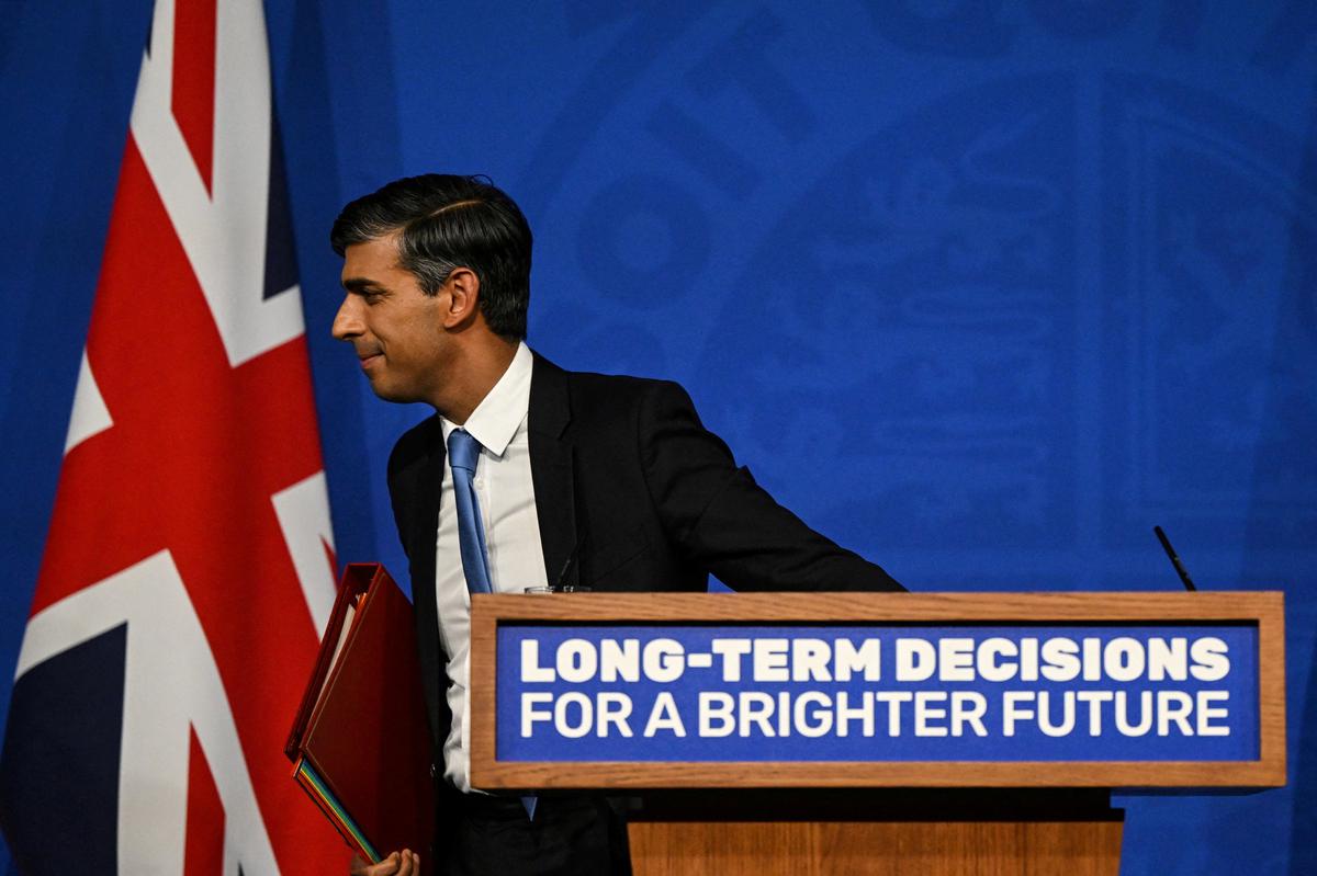 Britain’s Prime Minister Rishi Sunak leaves the stage after delivers a speech during a press conference on net zero targets, at the Downing Street Briefing Room, in central London, on September 20, 2023.