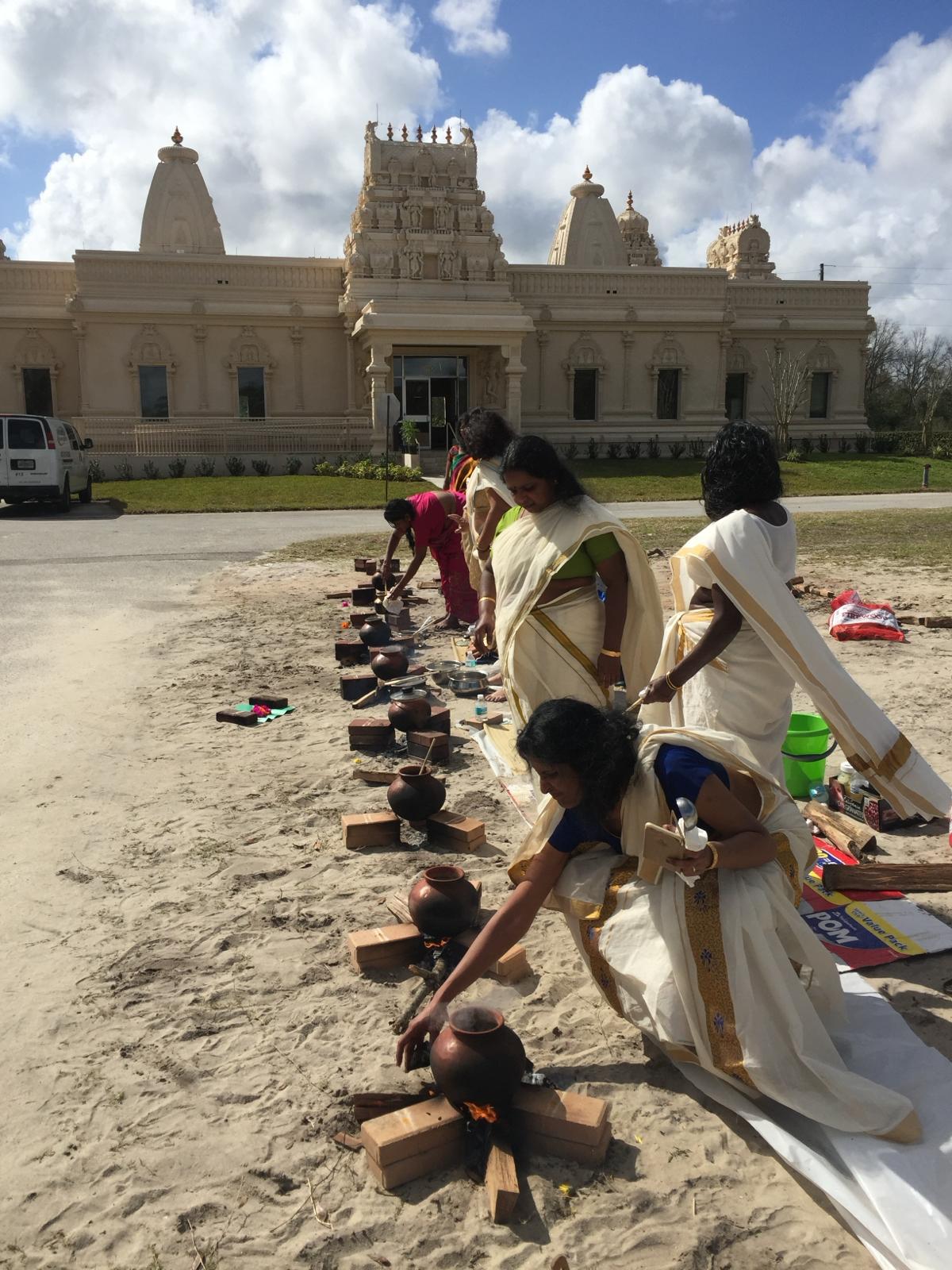 Devotees offering Pongala on open hearths at indu Society of central Florida, Orlando, in the US.