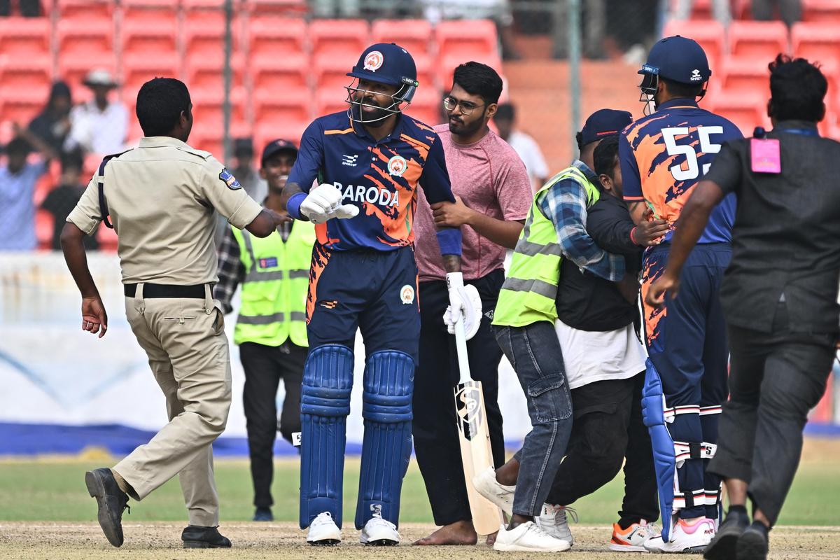 Hardik Pandya stops a security guard from escorting a fan away during the Syed Mushtaq Ali Trophy clash between Baroda and Punjab at the Rajiv Gandhi International Stadium in Uppal, Hyderabad, on Tuesday.