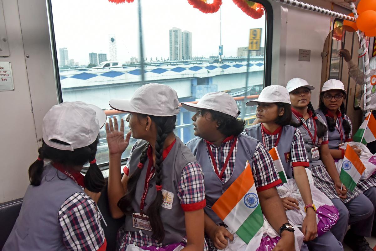 Schoolchildren enjoy their ride on a newly inaugurated metro service in Kolkata on Friday, August 22. 
