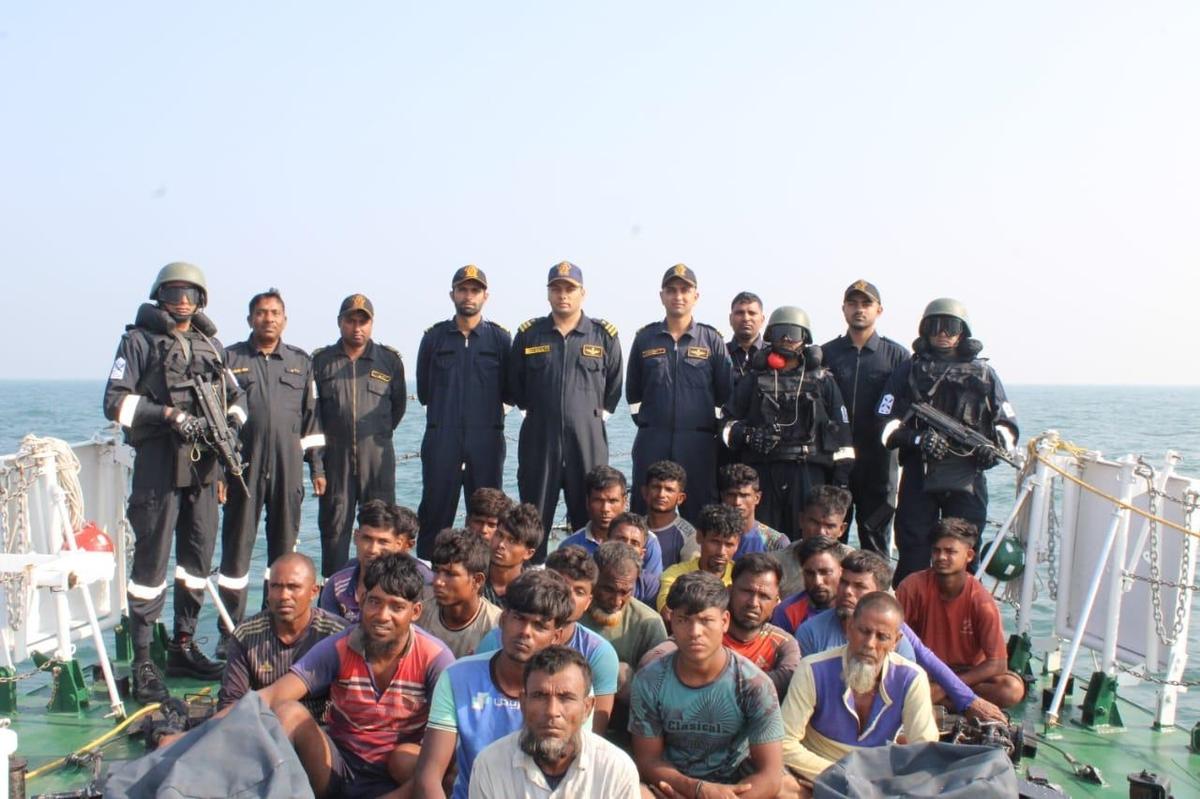 Indian Coast Guard with the persons who have been apprehended during an interception. Photo: Special Arrangement